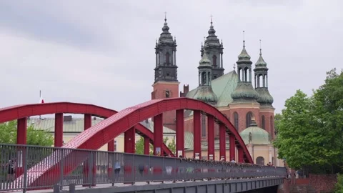 Love locks on a bridge in Gniezno with a historic church in the background Stock Footage 309008053