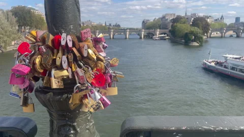 Love locks on a bridge over the River Seine. . Stock Footage 347286607