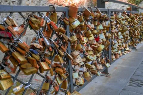 Love Locks on the bridge railing with names on different languages in Tbilisi Stock Photos