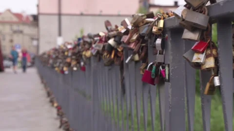 Love locks on a bridge in an urban setting Stock Footage 309012820
