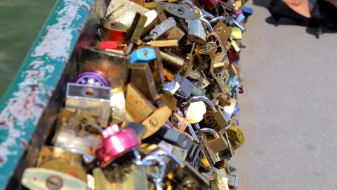 Love locks hanging on a bridge in Paris France near Notre Dame de Paris Stock Footage 105522697