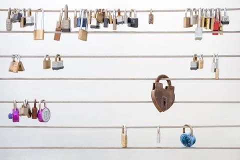 Love Locks Hanging from a Cable Railing Stock Photos