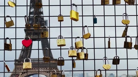 Love Locks on an Iron Lattice with the Eiffel Tower in the Background, Paris. 動画素材 227712443