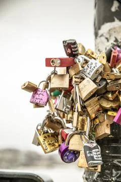 Love locks (or padlocks) on a light pole in Paris, France Stock Photos