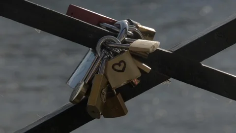 Love locks padlocks on the love bridge, Pont des Arts, in Paris on a sunny Видео 110693484