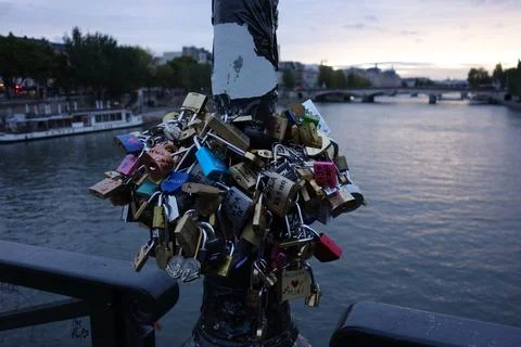 Love locks on a pole on the Pont des Arts Bridge over Seine River Stock Photos