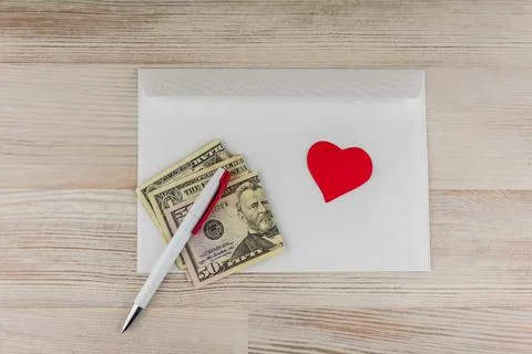 Love mail: the white empty blank envelope for letters, a white ball pen and r Stock Photos