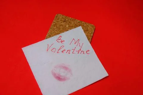 Love message left on red table, valentine concept Stock Photos