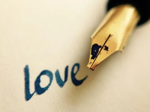 Love message with pen Stock Photos