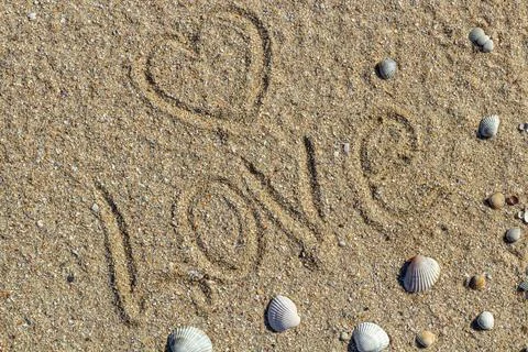 Love message written in sand, background for design Stock Photos
