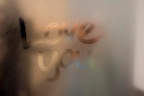 Love note on a steamy mirror	 Stock Photos