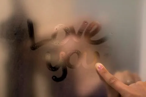 Love note on a steamy mirror	 Stock Photos