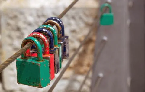 Love padlocks on the railing of a bridge. Stock Photos