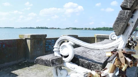 Love Padlocks on White Bench by the Lake 스톡 동영상 333554135