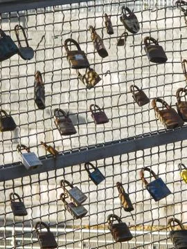 Love padlocks on wire mesh bridge Stock Photos