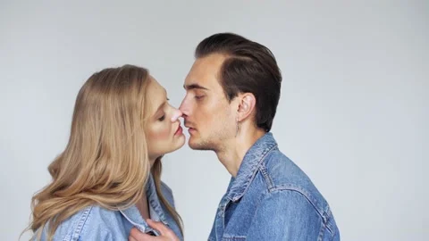 Love, passion, relationship conception: young couple hugs and kisses Stock Footage 130378369