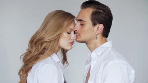 Love, passion, relationship conception: young couple hugs and kisses Stock Footage 130381366