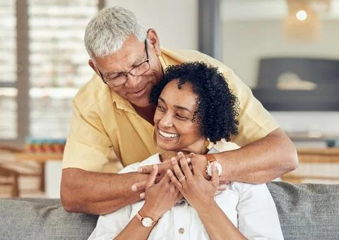 Love, relax and senior couple hug, care and enjoy quality bonding time on home Stock Photos