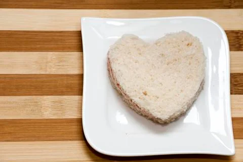 Love sandwich on a wooden background Stock Photos