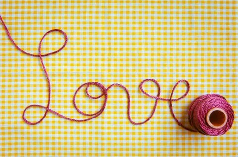 Love script in crochet yarn Stock Photos
