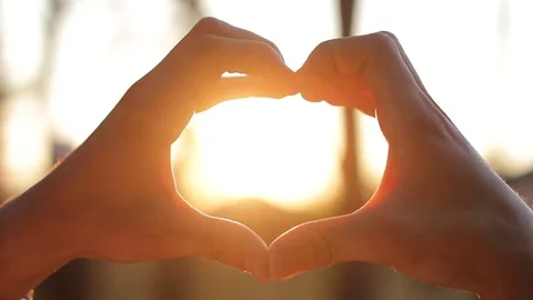 Love shape of hands at sunset. Close up Video stock 86596223