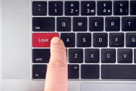 Love text on red keyboard button in a laptop keyboard Stock Photos