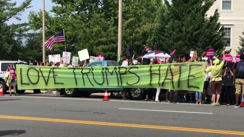 Love Trumps Hate. Says sign during protest in Washington, USA Stock Footage 79606084