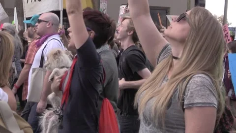 Love Trumps Hate Sign Bearers Protest Donald Trump in 2020 Video stock 226884351