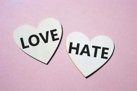 Love vs Hate symbol. Concept word Love vs Hate on wooden hearts. Beautiful .. 스톡 사진