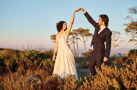 Love, wedding and holding hands for dance with couple in nature park for Stock Photos