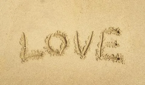 Love write in the sand Stock Photos