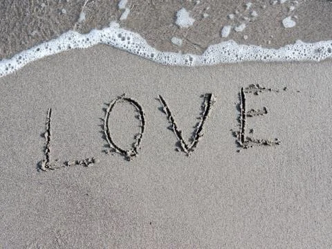 LOVE written on beach Stock Photos