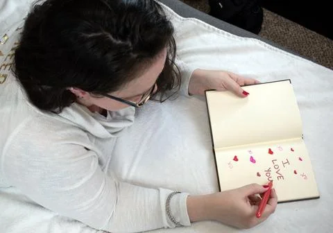 Love written in a Notebook Stock Photos