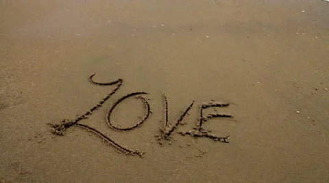 Love Written in the Sand Gets Washed Away Stock Footage 66064751
