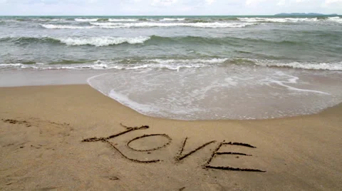 Love Written on the Sand Gets Washed Away by a Wave Stock Footage 66065107