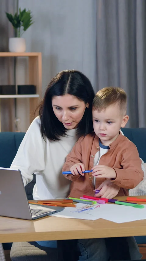 Lovely 2-aged interested child uses colourful felt-tip pens to draw elementary p Stock Footage 328846854
