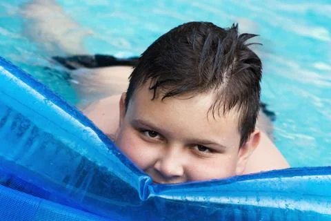 Lovely boy in swimming pool Stock Photos