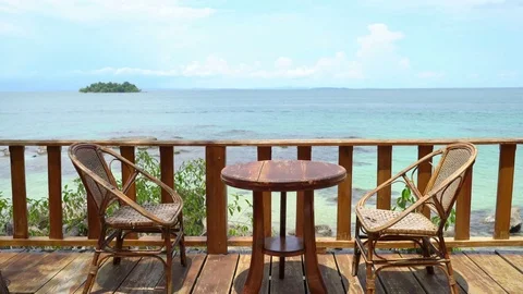Lovely Bungalow Scene, Empty Table, Tree House Balkony, Ocean View Stock Footage 76511589