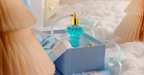 Lovely Christmas gift boxes pack blue perfume inside. Vídeo Stock 346060462