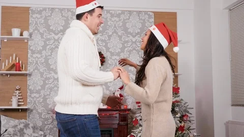 Lovely couple dancing and having fun in Christmas eve Stock Footage 115539746