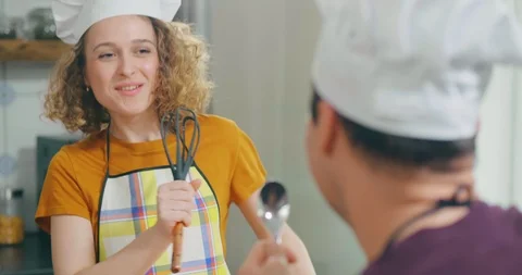 Lovely couple having fun in kitchen Stock Footage 114121920