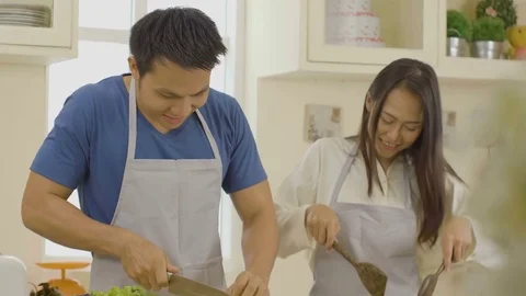 Lovely couple in the kitchen Stock Footage 79419597