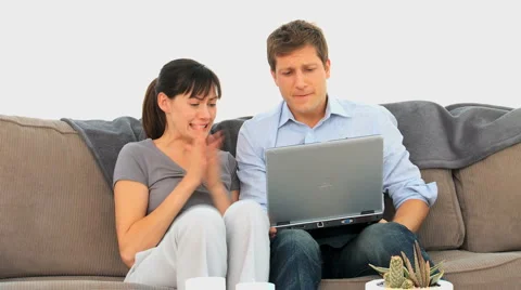 Lovely couple winning something on internet Stockbeeldmateriaal 1097008