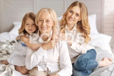 Lovely extended family hugging each other Stock Photos