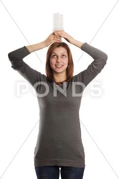 Lovely girl holding a fluorescent lamp over his head Stock Photos