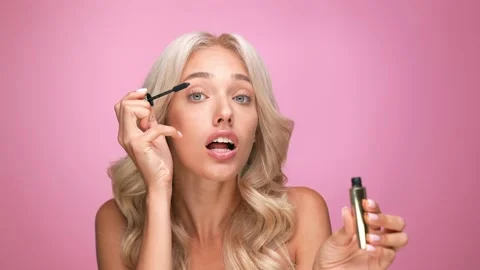 Lovely girlfriend date event use mascara face isolated pastel color background Stock Footage 166095133