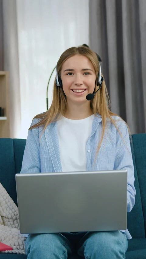 Lovely joyful in high spirits 20-aged blondie in headphones dressed in casual cl Stock Footage 331438875