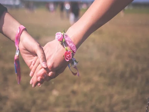 Lovely lesbian couple women are holding hands; Slow motion Stock Footage