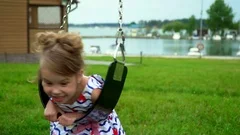 Little girl on swing set stock footage. Video of student - 95599928