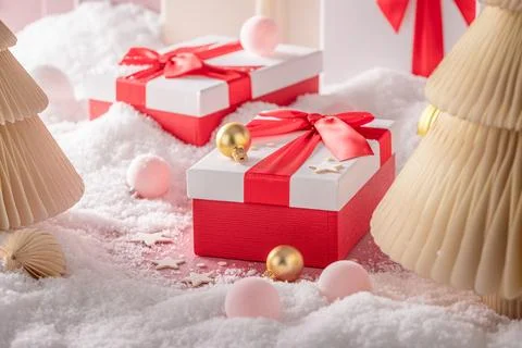 Lovely red gift package featuring bright ornaments. Stock Photos